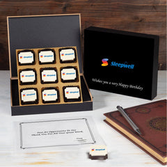 Black corporate birthday gift box containing six logo chocolates with personalised branding and message