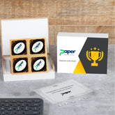 Open wooden gift box with logo chocolates and “Congratulations” lid message