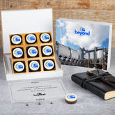 Angled shot of black 9‑pc logo chocolate box for inauguration gifting