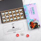 Front view of luxury birthday invitation with 18 printed chocolates in elegant box