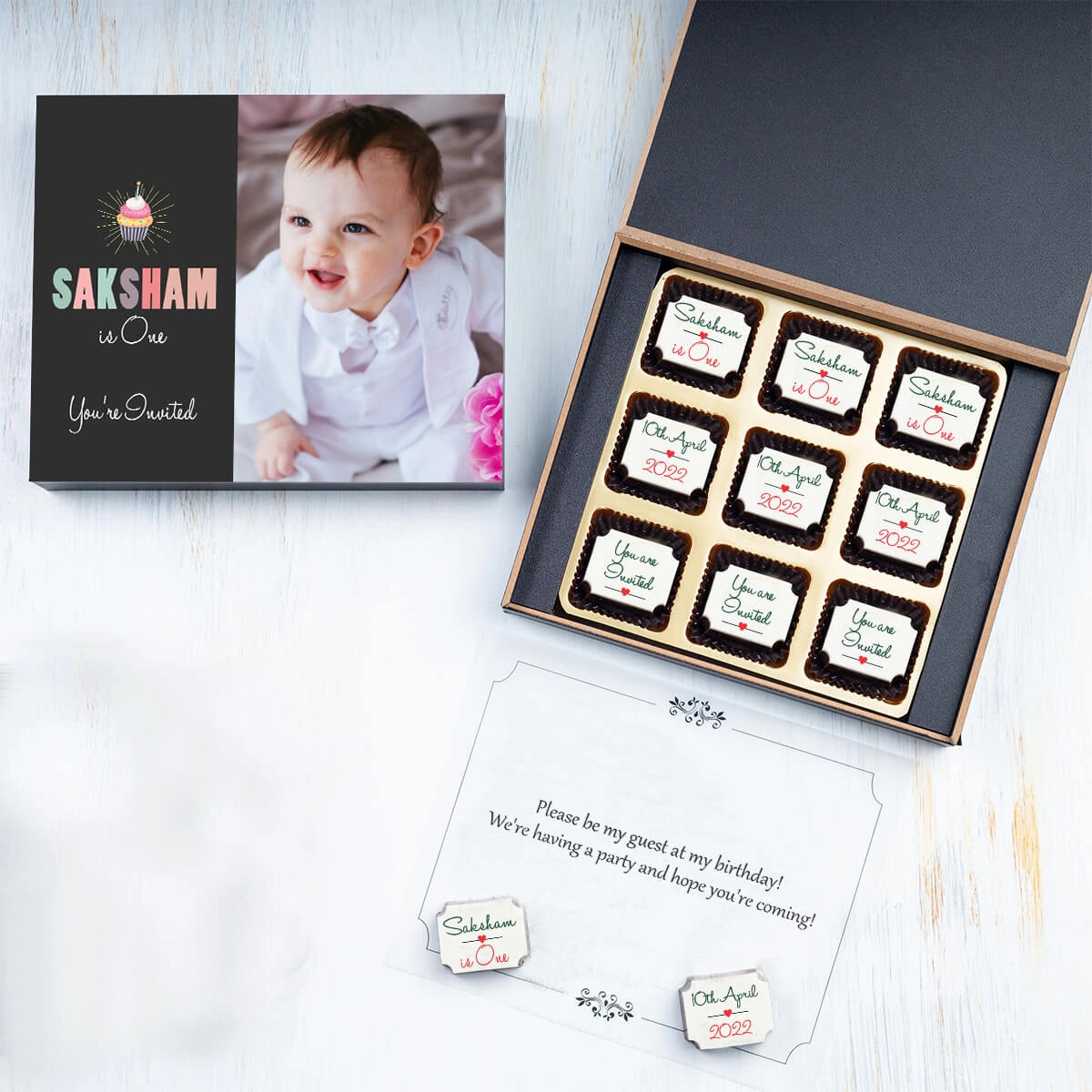 Open box showing photo chocolates for 1st birthday invitations photo sample