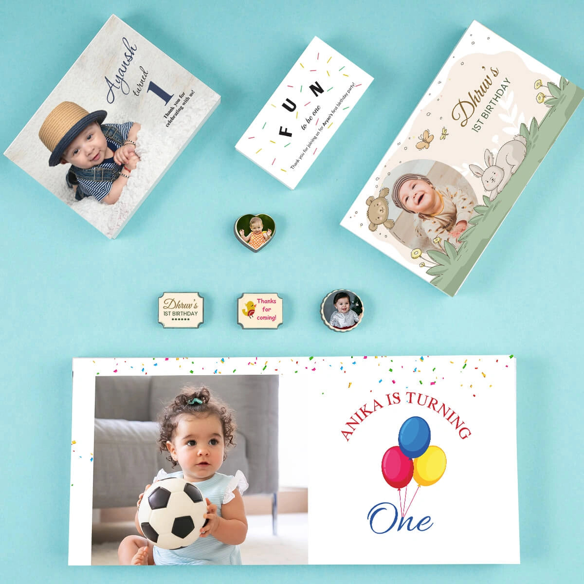 Flat-lay of inserts and chocolates for 1st birthday return gifts online