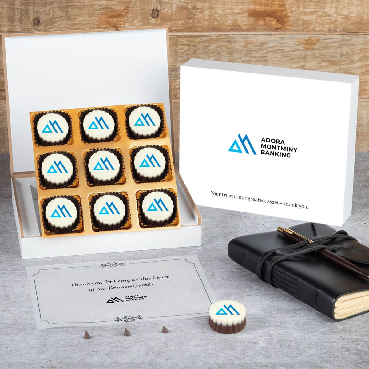 Nine‑piece luxury chocolate box with ribbon for high‑net‑worth banking clients.