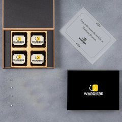 Closed black MDF box with engraved logo and thank‑you sleeve on lid