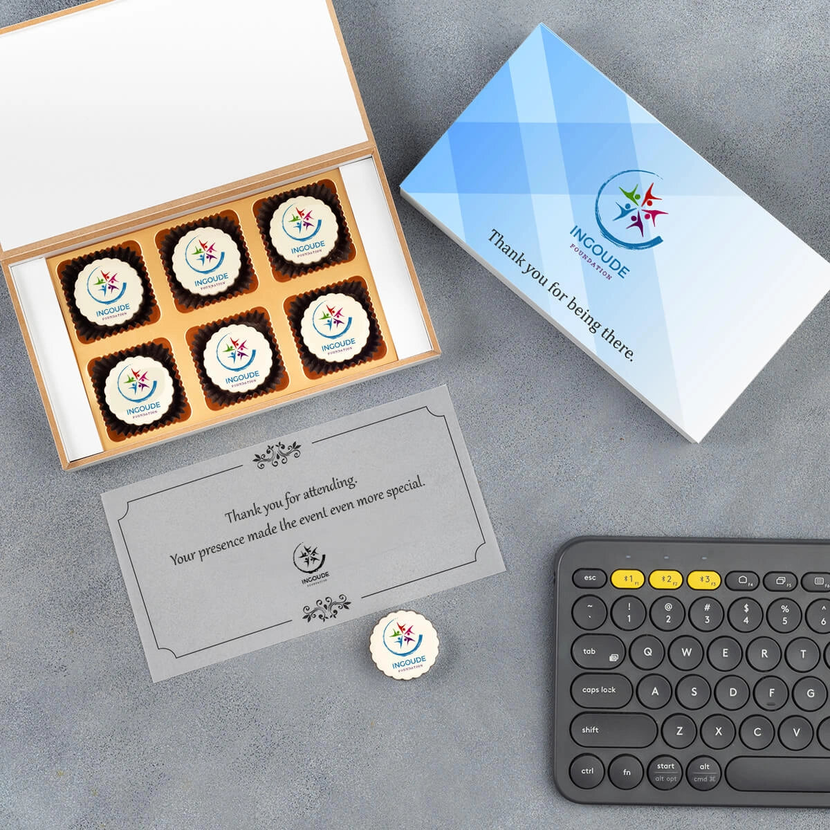 White wooden gift box filled with printed chocolates for attendees