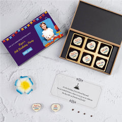 Close-up of edible birthday invitation printed on white chocolate