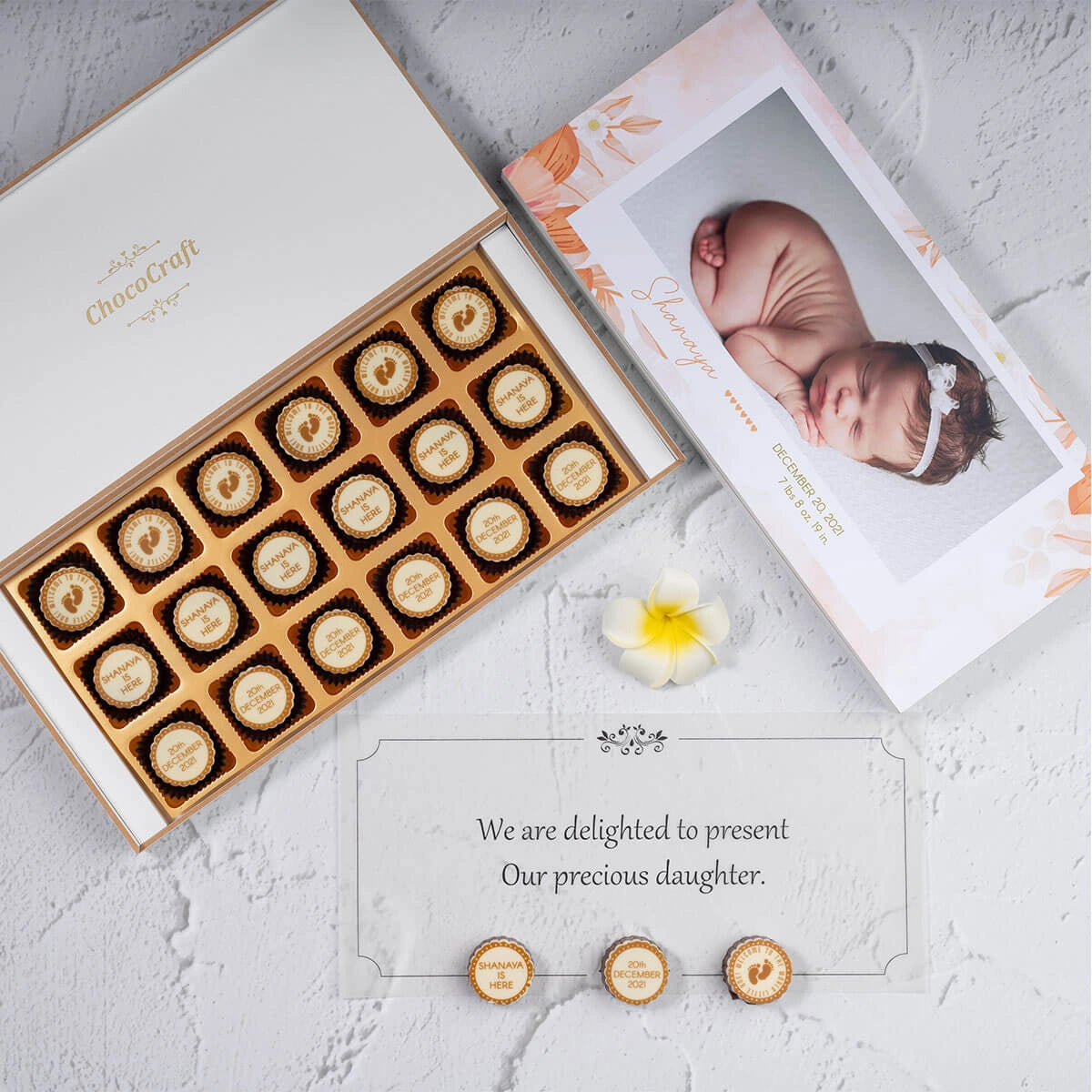 Personalized butter paper message inside chocolate birth announcement box