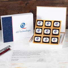 Branded 9‑chocolate gift box with lid removed, ideal for client anniversary gifting.