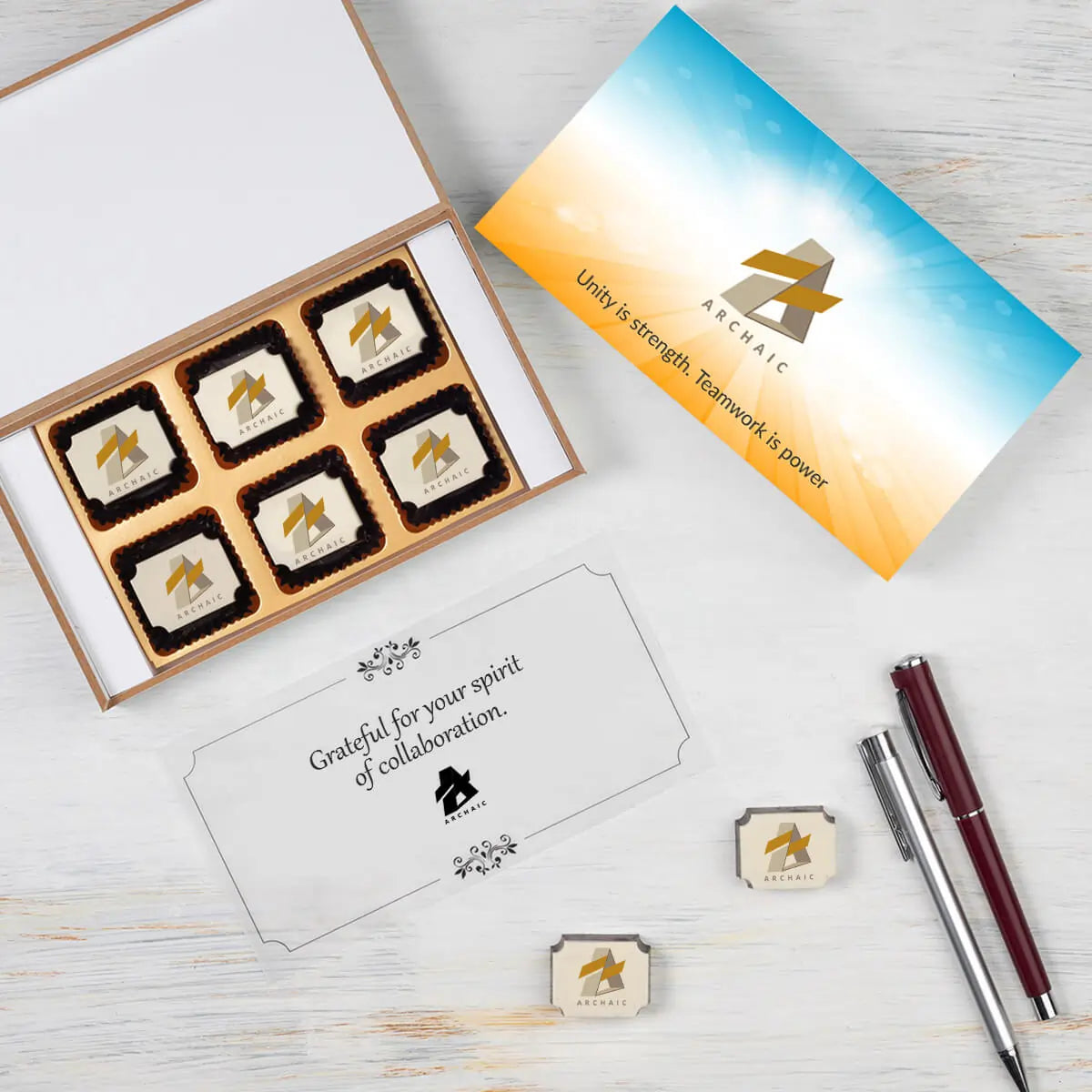 Box and chocolates arrangement with company logo — employee appreciation gift