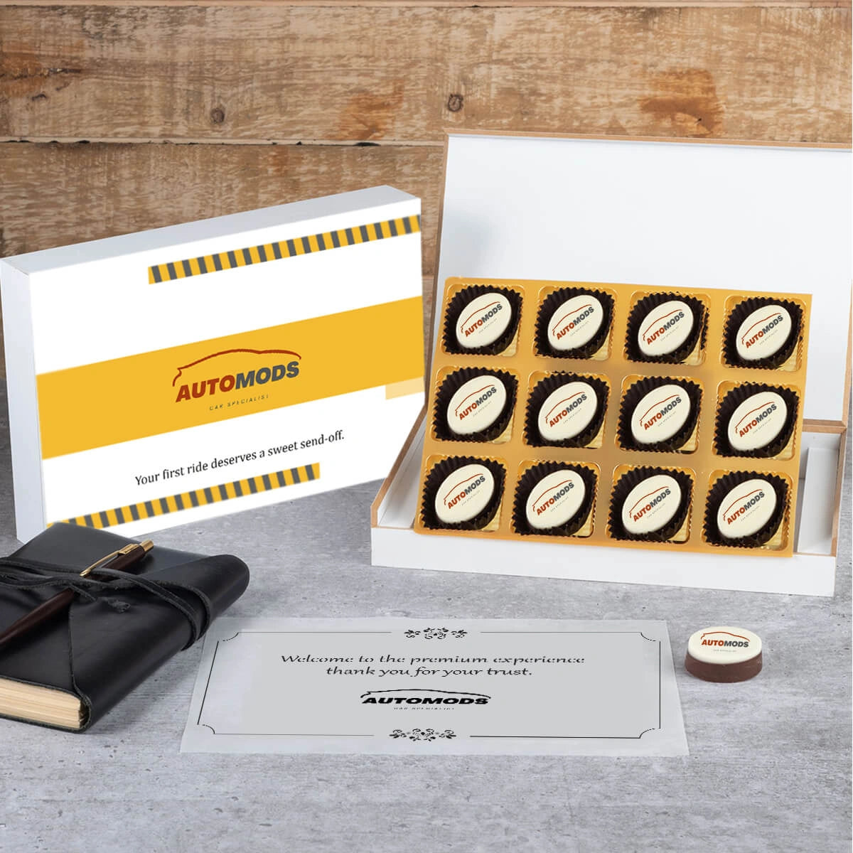 Custom car delivery gift set showing printed chocolates inside elegant box