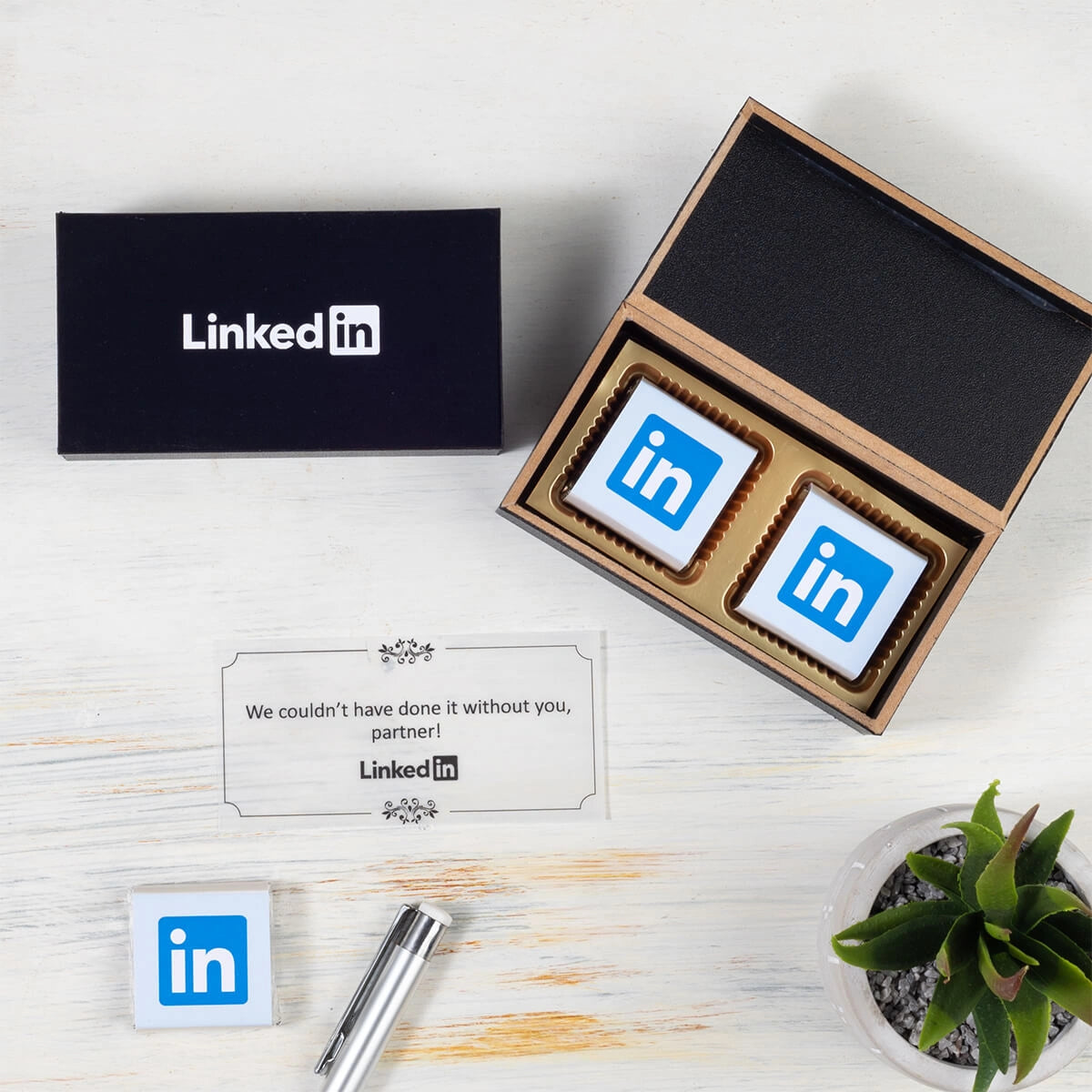 Custom chocolate box featuring logo-wrapped chocolates