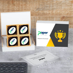 Open wooden gift box with logo chocolates and “Congratulations” lid message