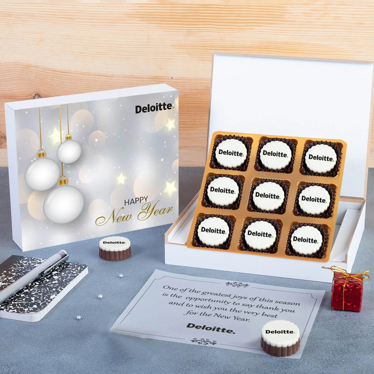 Wooden box opened to reveal 9 chocolates — stylish good company Christmas gifts presentation