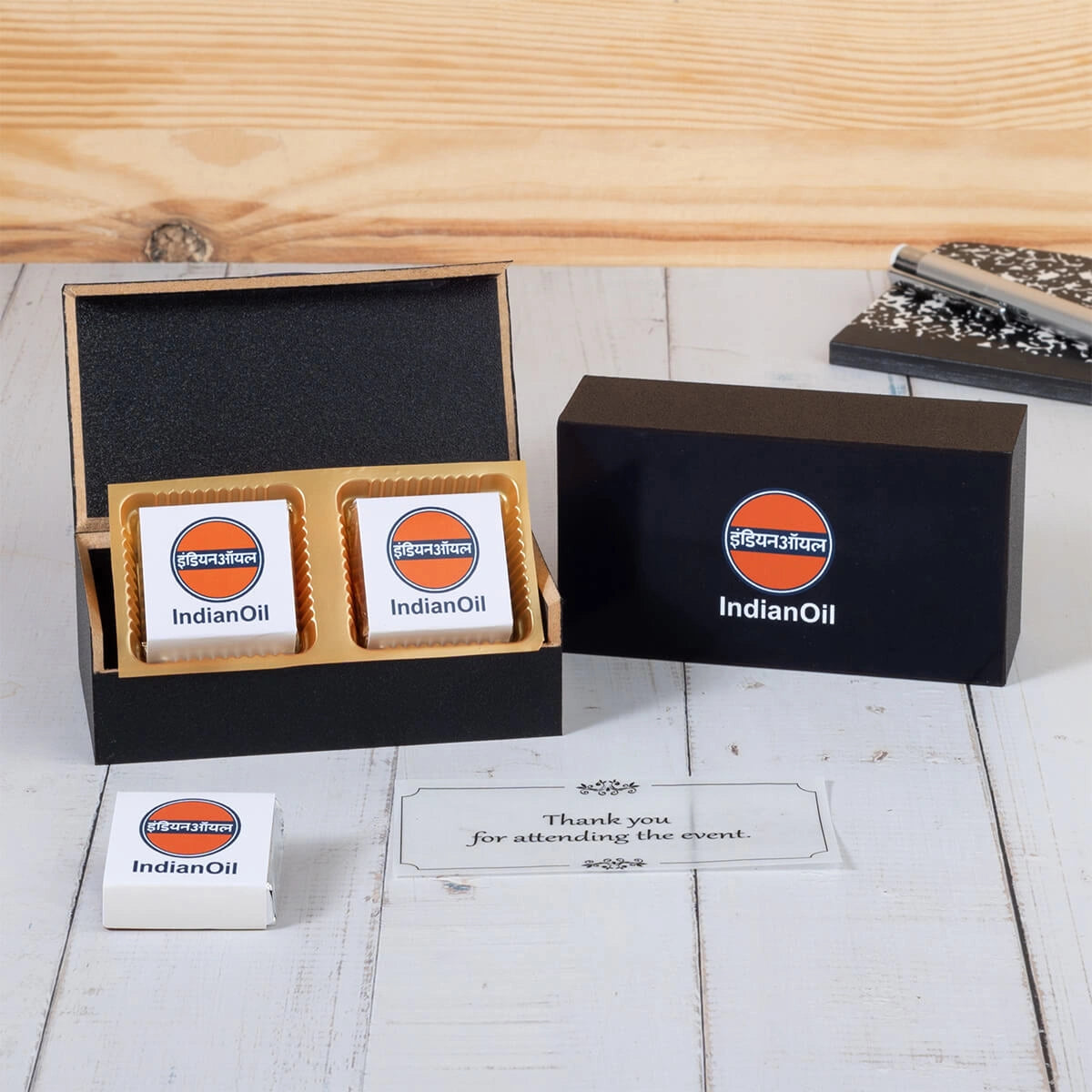 Two logo-wrapped chocolates in premium corporate gift box
