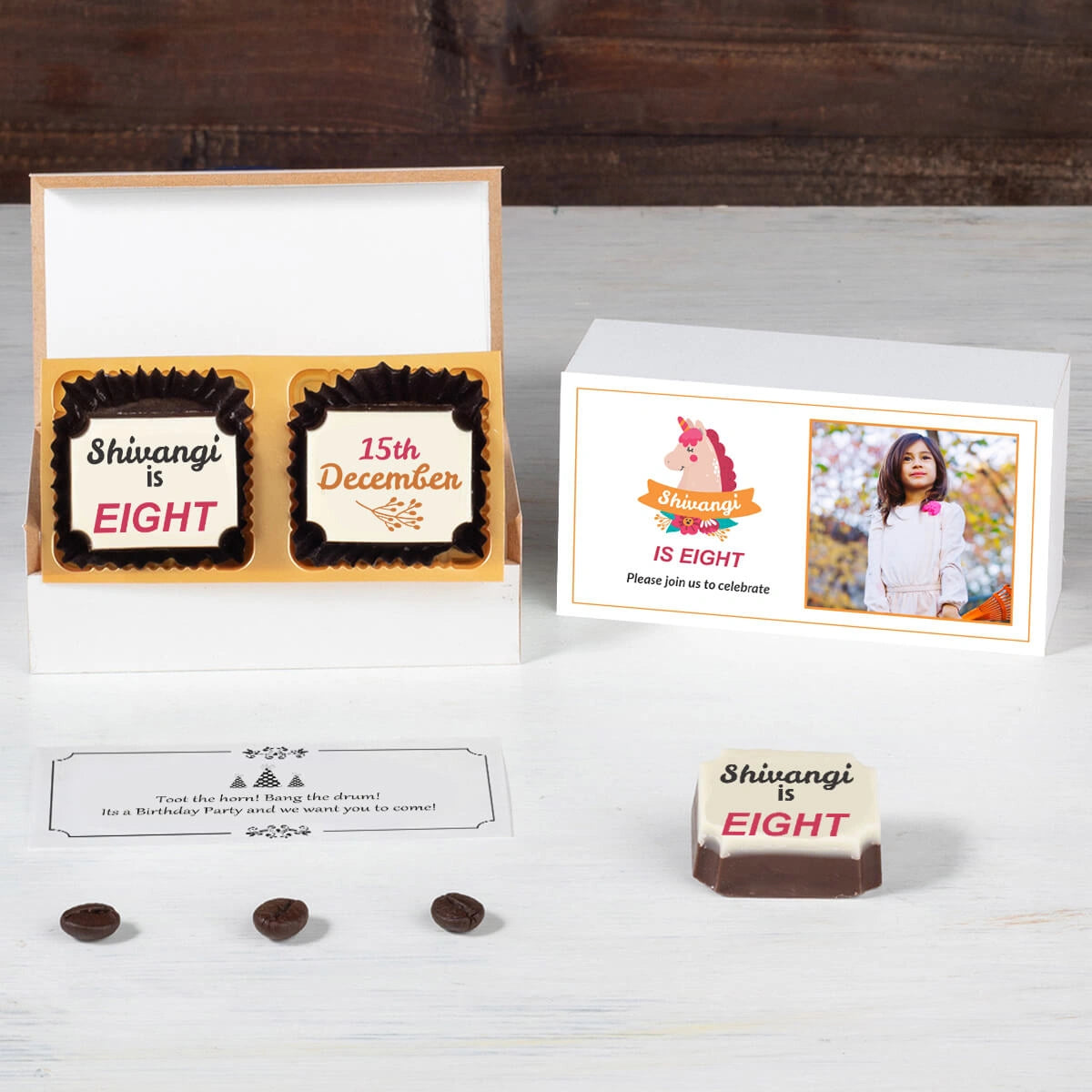 Top view of personalised party invites in elegant chocolate box