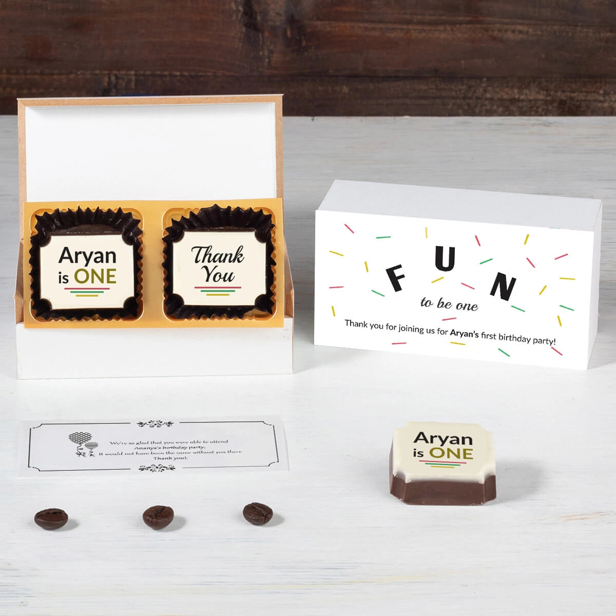 Table setup with personalized chocolate favors for 1st birthday