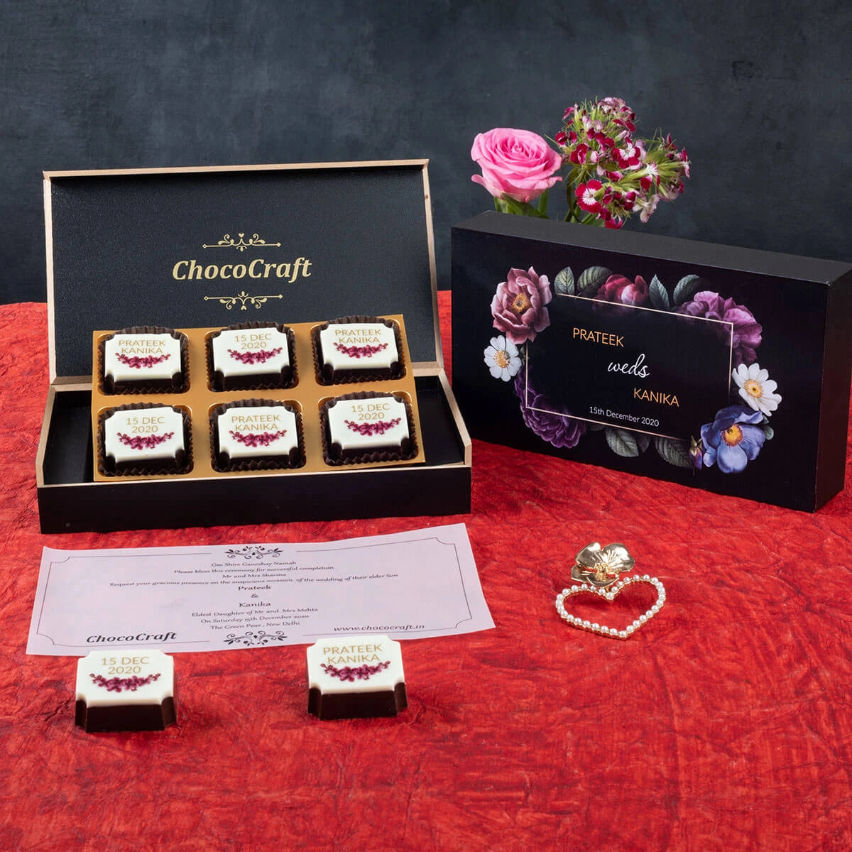 Top view of personalized wedding invitation box with printed chocolates