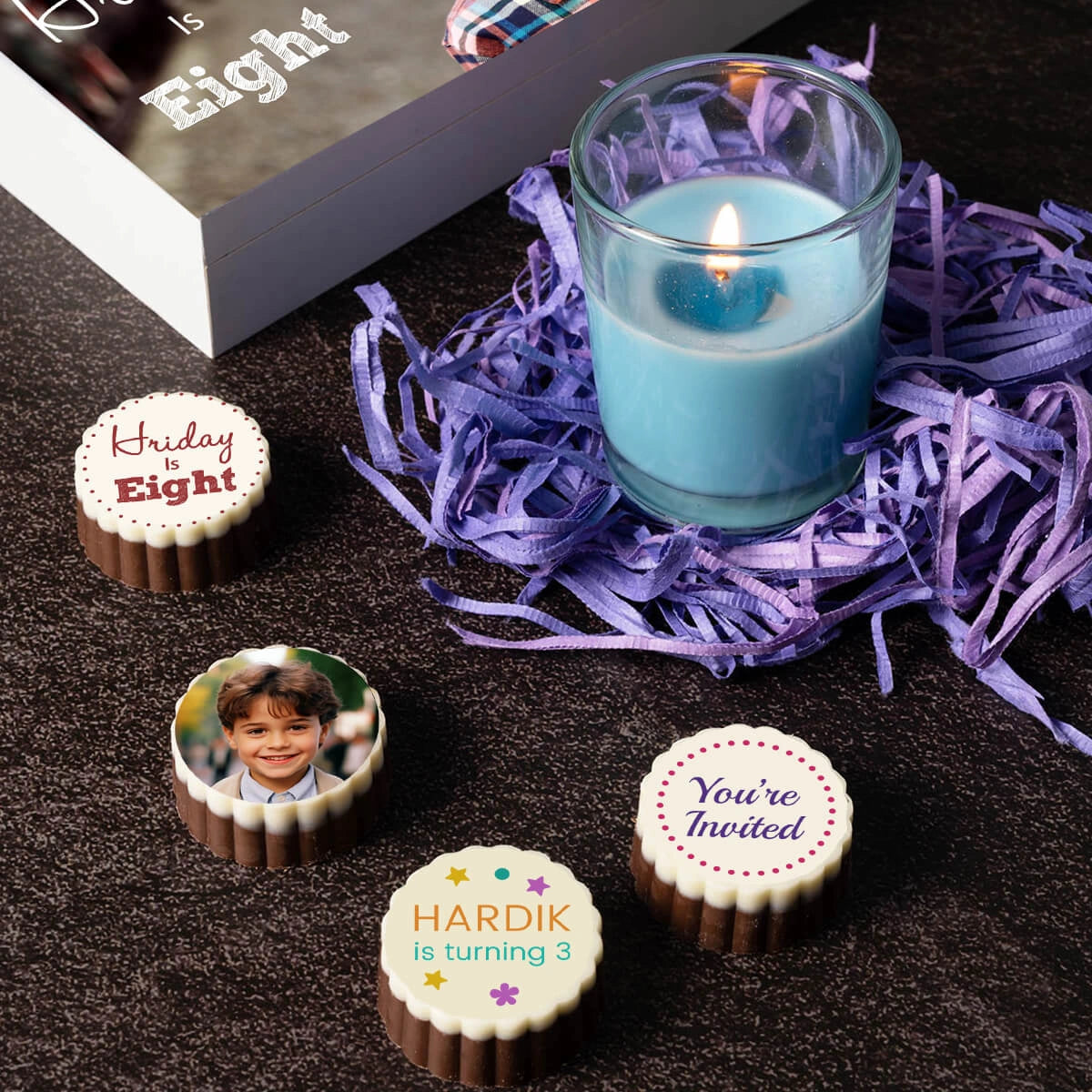 Birthday invitation box with personalized photo prints on chocolates