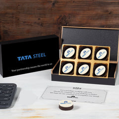 Open MDF box showing two thank‑you logo chocolates with personalised butter paper