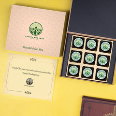 Branded wooden box filled with Thanksgiving‑themed chocolates for corporate gifting