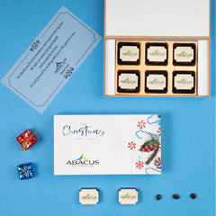 Black wooden 12‑piece box with printed chocolates and company logo sleeve